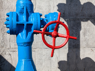 Red valve on the blue pipe.