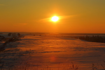 sunset bright orange sun in winter