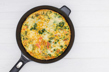 Frittata with herbs, tomatoes and feta cheese