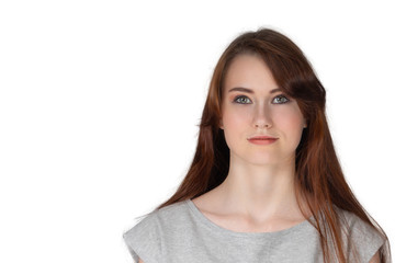 Fototapeta premium Portrait of a young girl with brown hair on a white background