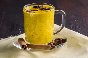 Golden latte milk made with turmeric and spices.