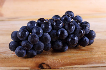 Black grape on table