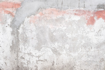 Fragment of an old wall in gray, white and pink colors