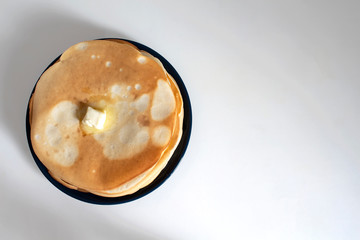Homemade pancakes with butter. Top view.