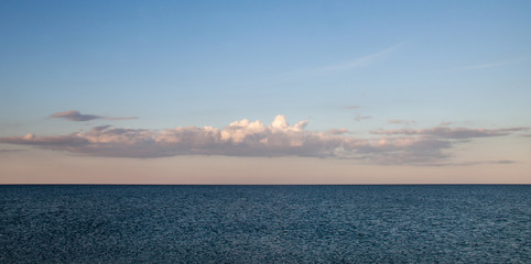Seascape. Calm sea. Sky and clouds over the sea.