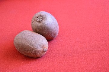 kiwi fruits on a red background