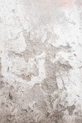 Fragment of an old wall in gray, white and pink colors