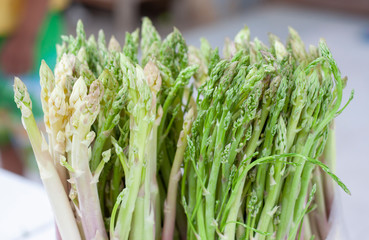 Fresh Asparagus in plastic bag for sale in the market.