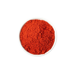 Bowl of pepper powder spice isolated on white background