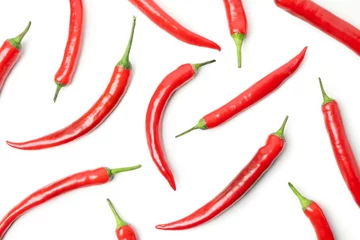 Fotobehang Flat lay with chilli peppers isolated on white background © Atlas
