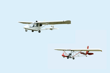 Two airplanes on a light background.