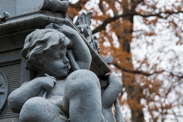 stone statue with the figure of a child