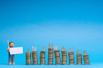 Man made from plasticine holding a blank sheet of paper and a match to the left of a bunch of columns made from coins, with the word insurance placed on top of them a letter each, on blue background.