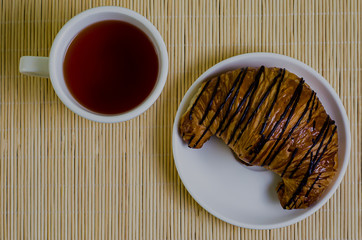 croissant and cup of tea