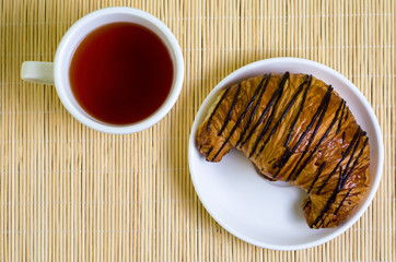 croissant and cup of tea