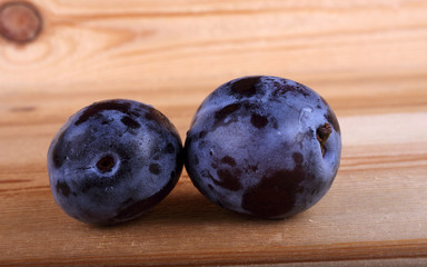 Plums on table
