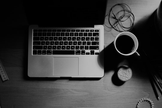 vintage pictures with laptop, cup of tea, cookies and headphones