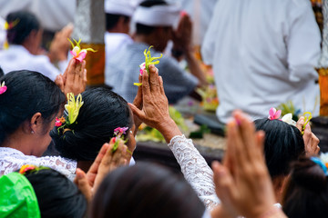  Indonesian people offers a Balinese Hindu prayer in the morning in Bali