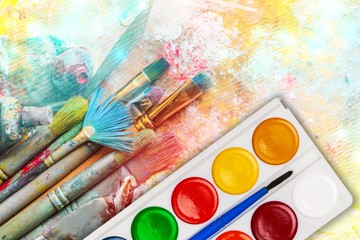 Artist brushes and paintings with creative art painting
