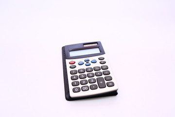 Electronic calculator on White background.