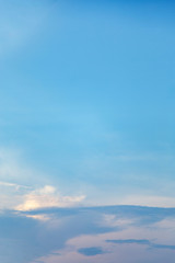 Vertical image white clouds in blue sky in summer day.