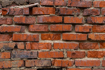 old crumbling abandoned brick wall