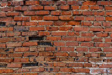 old crumbling abandoned brick wall