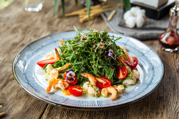 Gourmet salad with arugula and shrimps