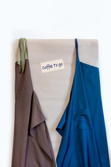 delivery service coffee to go two apron shipment package blue brown wall advertisement
