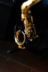 Lonely saxophone on black background