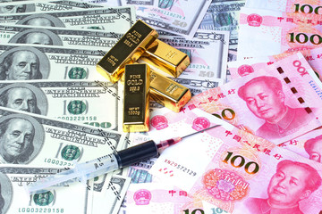 Varites dollar money ,golden bars  and blood in syringe on banknotes lay spread double.