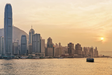 Star ferry at Victoria Harbor in Hong Kong at sundown