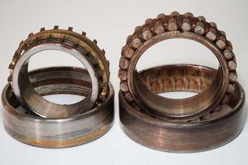 Old bearings for industrial machinery on a white background
