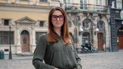 Outdoor close up portrait of young beautiful fashionable woman