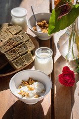 Milk, cereals and bread in breakfast set.