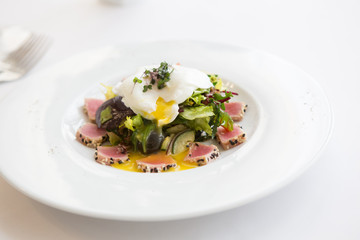 Egg benedict with tuna salad