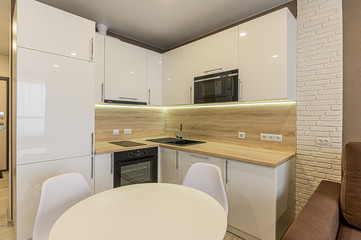 Russia, Moscow- January 15, 2020: interior room apartment modern bright cozy atmosphere. general cleaning, home decoration, preparation of house for sale. modern kitchen, dining area