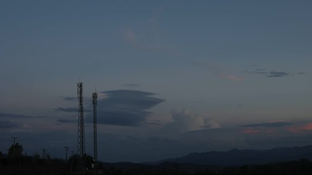 Telecommunication tower on top of the mountain with colorful sky, Time lapse