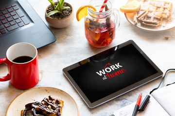 working from home in self-isolation, freelance on lockdown. Workspace with tablet and Breakfast on white background. working at home with your family. Stay at home. Flat lay, top view.
