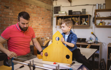 Father and Son Making a Birdhouse