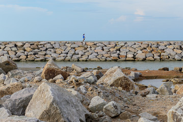 Large stones Was prepared in place of the sandy beach for the wave walls