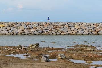 Large stones Was prepared in place of the sandy beach for the wave walls