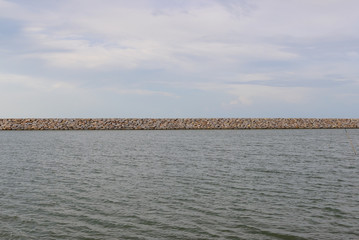 Large stones Was prepared in place of the sandy beach for the wave walls