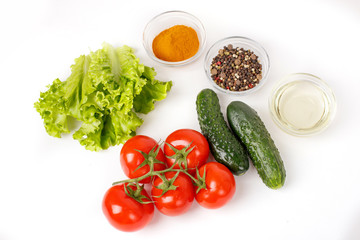 tomatoes and cucumbers and spices isolated on a white background, cooking concept. Food background.