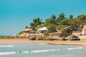 Canacona, Goa, India. Sunny Sky Over Calm Water Of Arabian Sea. Natural Landscape With Sandy Palolem Beach At Sunny Summer Day With Blue Sky