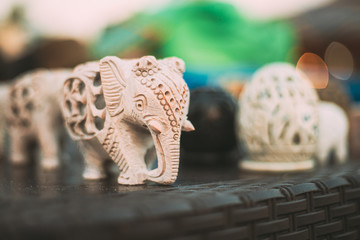 Naklejka premium Goa, India. Elephants Souvenirs Of Stone On Shelf In Store. Goods For Tourists