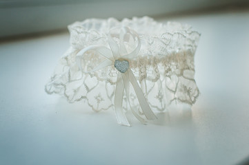 White garter with heart on the table