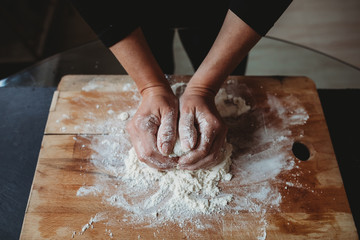 Hands preparing and kneading gnocchi 