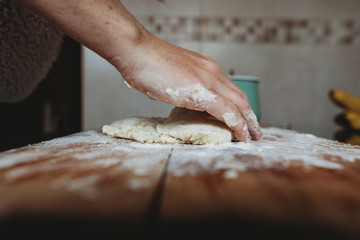 Hands preparing and kneading gnocchi 