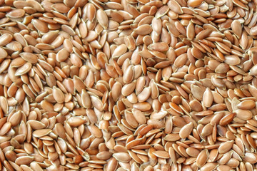 Flax seeds background top view